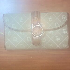 Gently used Dooney and Bourke, wallet, tan, and brown